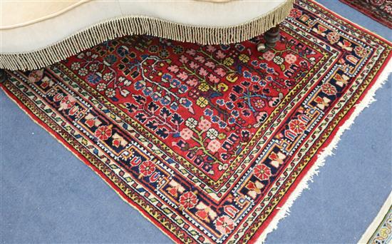 Two Persian red ground rugs W148cm x 105cm and 164cm x 105cm